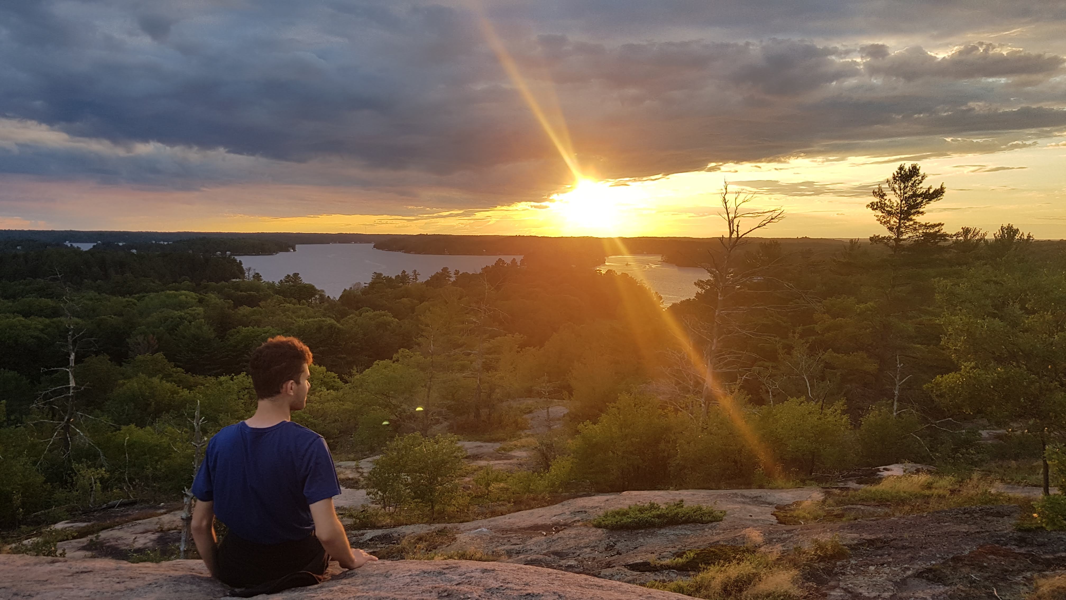 Responsive image of Jacob overlooking a sunset